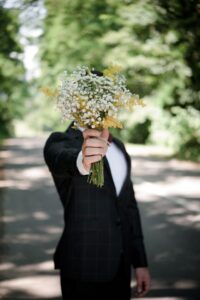Groom holding bouquet
