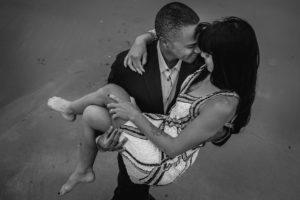 Black and white picture of couple dancing on beach